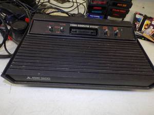 lot 133 image: Vintage Atari 2600 with games and controls
