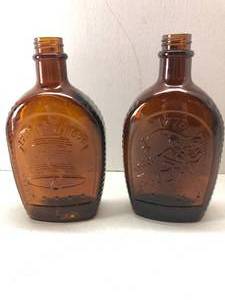lot 19 image: Lot of 2 Vintage Log Cabin Syrup Jars