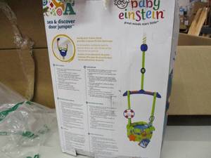 lot 16 image: Baby Einstein Sea and Discover Door...