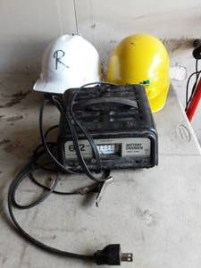 lot 13 image: Schumaker Battery Charger & 2-Hard Hats