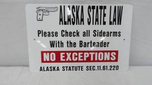 lot 17 image: Alaska State Law Tin Sign