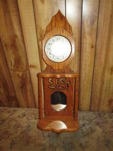lot 3 image: Oak Wood Wall Clock With Mirror Se...
