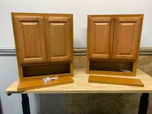 lot 76 image: STYLE SELECTIONS Lot of Two- 23.25-in W x 28-in H x 7-in D Oak Bathroom Wall Cabinet