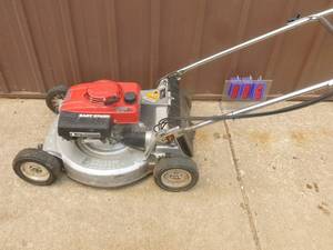 Honda self propelled lawn mower. Used condition. Tested & works. As shown.