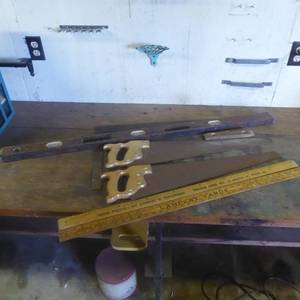 lot 65 image: Lot of Hand Saws, Wooden Levels, Square and Vintage Yardsticks
