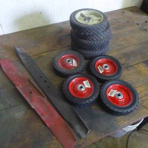lot 75 image: Lawn Mower Blades and Wheels Lot