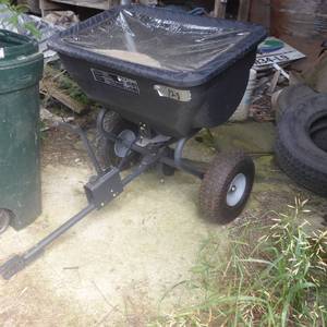 lot 128 image: Lot of Pull Behind Lawn Spreader and Grass Seed