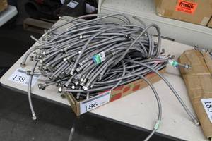 lot 186 image: Lot of (Approximately 50) BrassCraft Faucet Connector 38in. Comp. x 12in. 20in. , Fluidmaster No-Burst Stainless Steel Braid Faucet Connector 38in. Comp Remale 12in. , Stainless Steel Braid Faucet Connector 38in. Comp x 12in. IP 30in.
