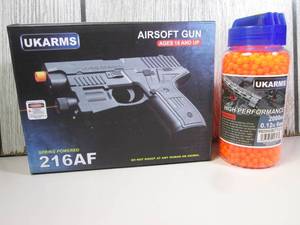 Airsoft Pistol and Bottle of 2000 B...
