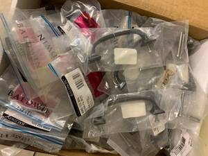 BOX OF ASSORTED RUBBED BRONZE HANDLES