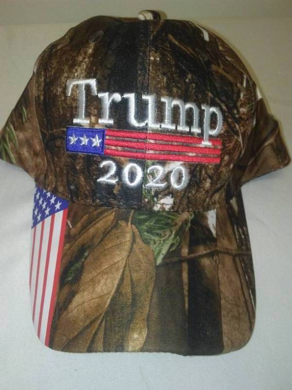 lot 62 image: Trump 2020 Camo Cap Hat  New. 100% cotton Velcro adjustable.