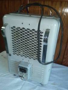 lot 110 image: 2  Titan Milk house heater working.