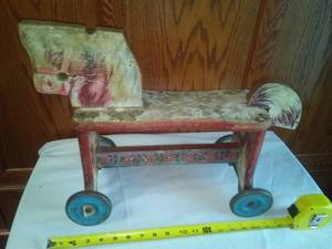 lot 119 image: Rare Wood metal Ride - on Horse, Bells sound when wheels roll