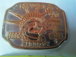 lot 123 image: Lady Liberty Belt Buckle  100 years old. 1886 - 1986 Statue of Liberty  New
