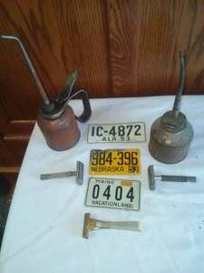 lot 184 image: License plates, razors & oil cans.