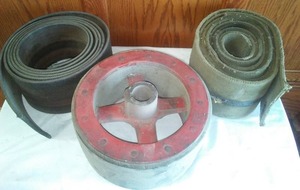 lot 186 image: Belting & drive wheel for tractor.