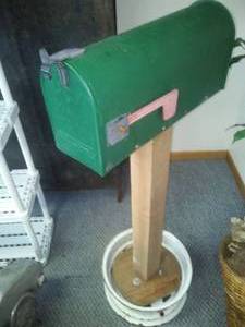 lot 261 image: Country Style mailbox on post & wheel rim.