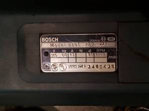 lot 41 image: Bosch angle grinder in hard metal case wextras