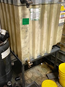 lot 17 image: Commercial 110-Gallon Bulk Tote With Steel Stand