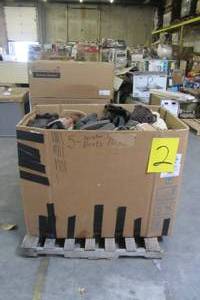Massive gaylord of hundreds of boots all paired together