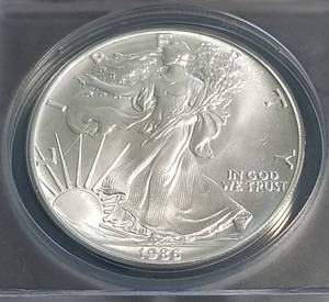 lot 12 image: 1986 AMERICAN SILVER EAGLE MS69 LEGACY COIN ANACS