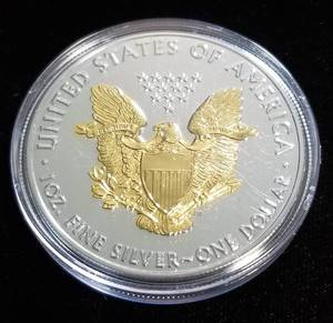 lot 25 image: 2019 AMERICAN SILVER EAGLE 1 TROY OZ. .999 FINE SILVER GOLD ENHANCED IN AIRTITE