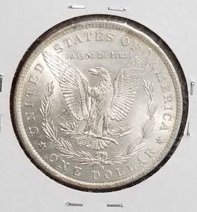 lot 39 image: 1884-O MORGAN SILVER DOLLAR IN HIGH GRADE