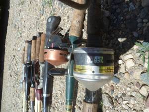 7 Fishing Rods & 2 Rods with Reels