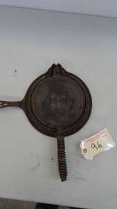 lot 96 image: Griswold Cast Iron Waffle Maker No. 8
