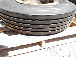 lot 32 image: Dayton 10.00R20 Tite on Dayton Rim...