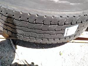lot 48 image: Recap 11R22.5 Tire on Hub Pilot Rim...