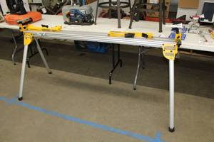 lot 66 image: DeWalt Heavy Duty Miter Saw Stand DWX723, Miter Saw Stand Work Piece Support and Length Stop DW7232
