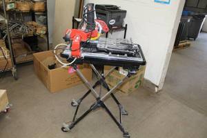 lot 64 image: Husky Tile Saw THD950L with Husky Stand