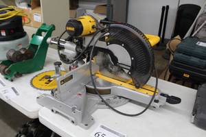 lot 65 image: DeWalt 12in. Double Bevel Sliding Compund Miter Saw DW718 with Extra DeWalt Construction 12in. 32T General Purpose Saw Blade