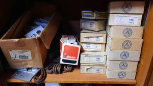 lot 175 image: Electrical Shelf Lot of Fluorescent Fixture Hangers, Wall Plates and More