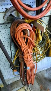 lot 192 image: Hook of Assorted Extension Cords and tubing Benders
