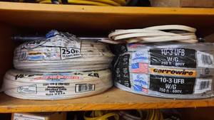 lot 364 image: Electrical Lot - Shelf of Romex Wire, 10-3 , and (2) 14-2 - Look Complete