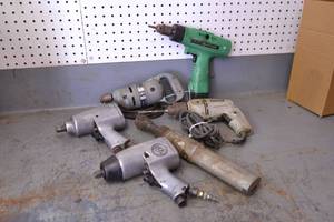 lot 90 image: (2) 12 Pneumatic Impact Guns, Cummins Model 130 Drill and Stanley Drill