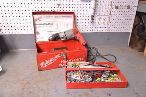 lot 106 image: Milwaukee 38 Hammer Drill w Bits and Hardware in Case