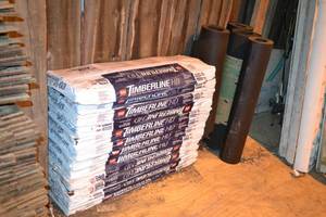 lot 130 image: (12) Bundles Timberline HD Shakewood Shingles  (4) Partial  Rolls of Tar Paper
