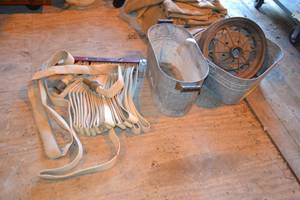 lot 393 image: Fire Hose, Galvanized Tubs, and 1930-31 Model A Ford Wheel Rim