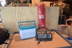 lot 407 image: Cooler, Battery Charger, and Marlboro Fold-Up Chair
