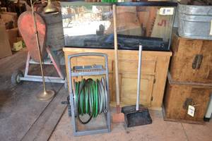 lot 411 image: Garden Hose Reel and Hose, Hoe and Dustpan