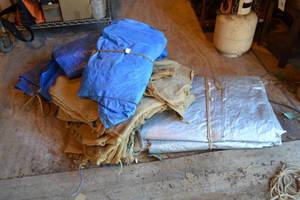lot 412 image: Pile of Tarps and Burlap Sacks