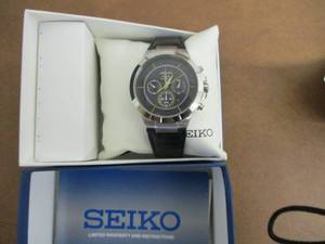 lot 19 image: Seiko Analogue Quartz Solar Watch...