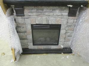 lot 77 image: Fireplace, outside is damaged, unte...