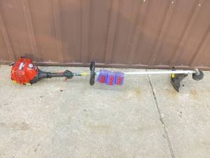 lot 22 image: Craftsman 4 cycle weed trimmer. Lightly used. Tested & works. As shown.