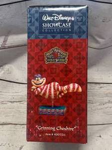 lot 31 image: Disney Jim Shore Grinning Cheshire New Old Stock Figurine