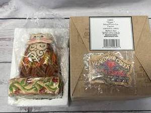 lot 39 image: Jim Shore Heartwood Creek Elijah YellowFlower Cat Figurine