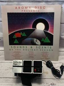 lot 51 image: Holiday Aroma Disc & Aroma Disk Player Diffuser